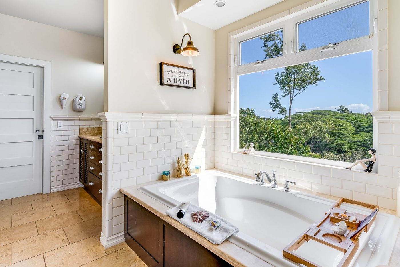 Bathroom with soaking tub and window