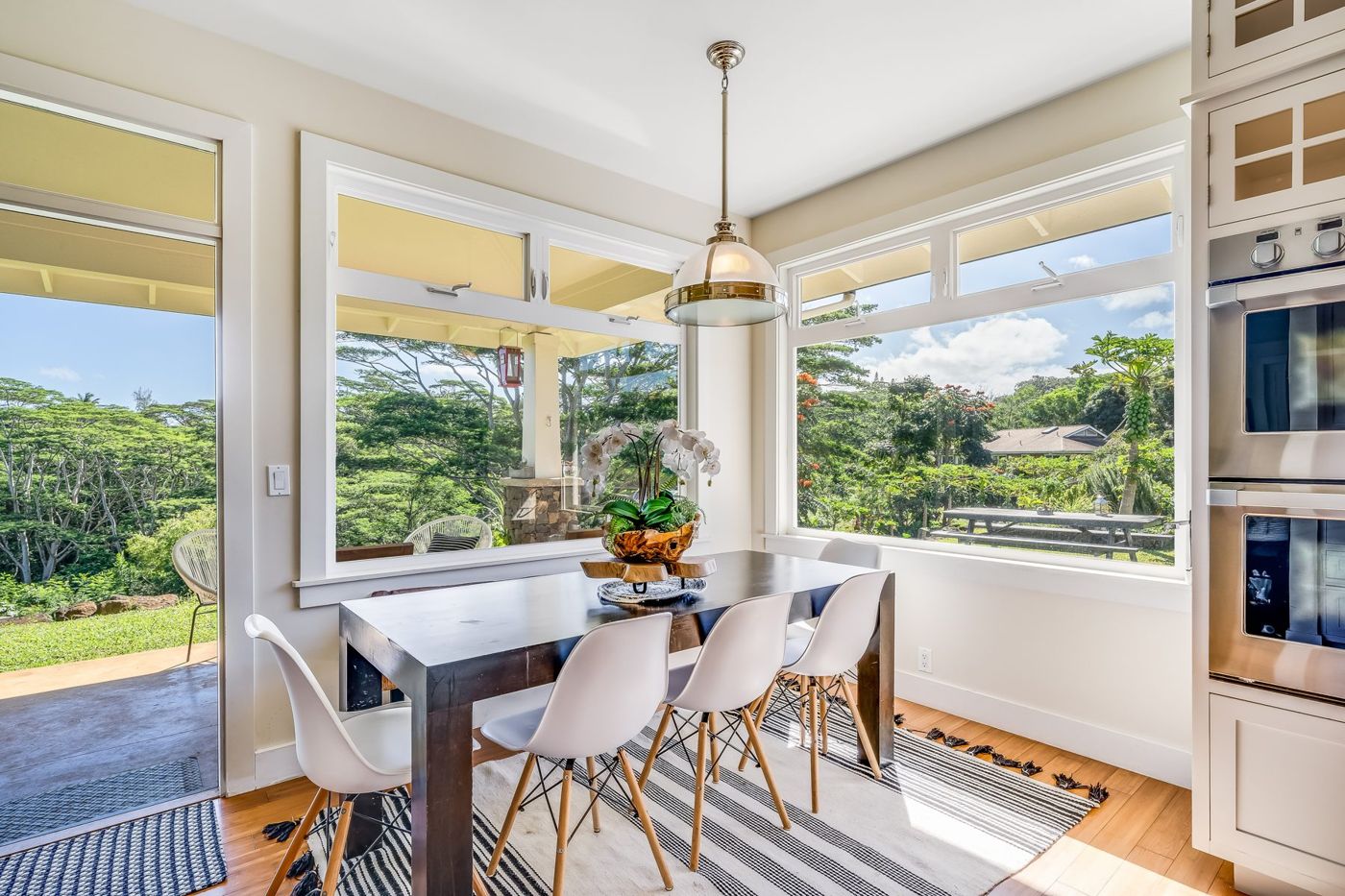 Dining table by windows with garden views