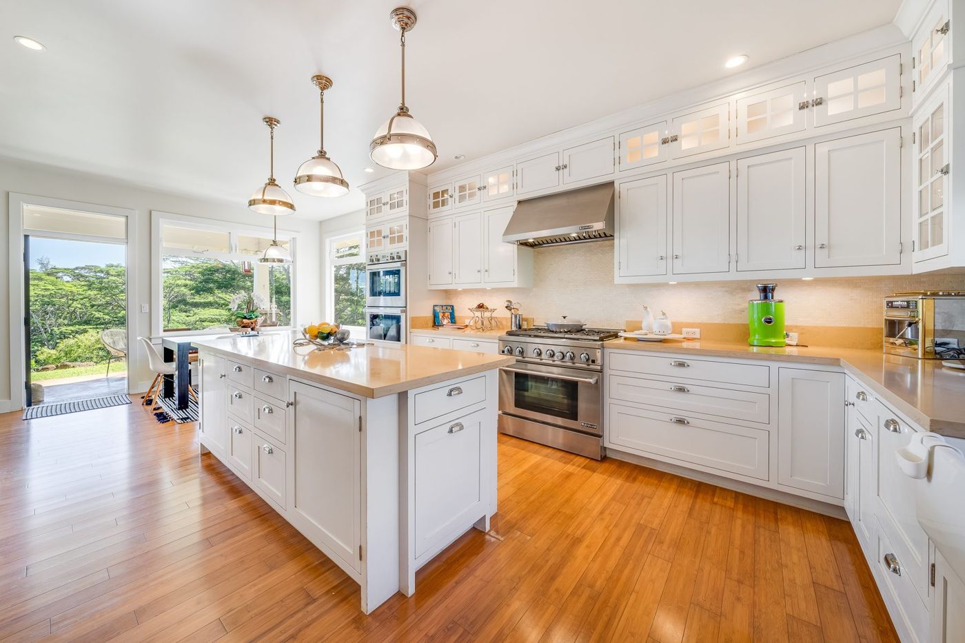 Open kitchen with white cabinets and an island