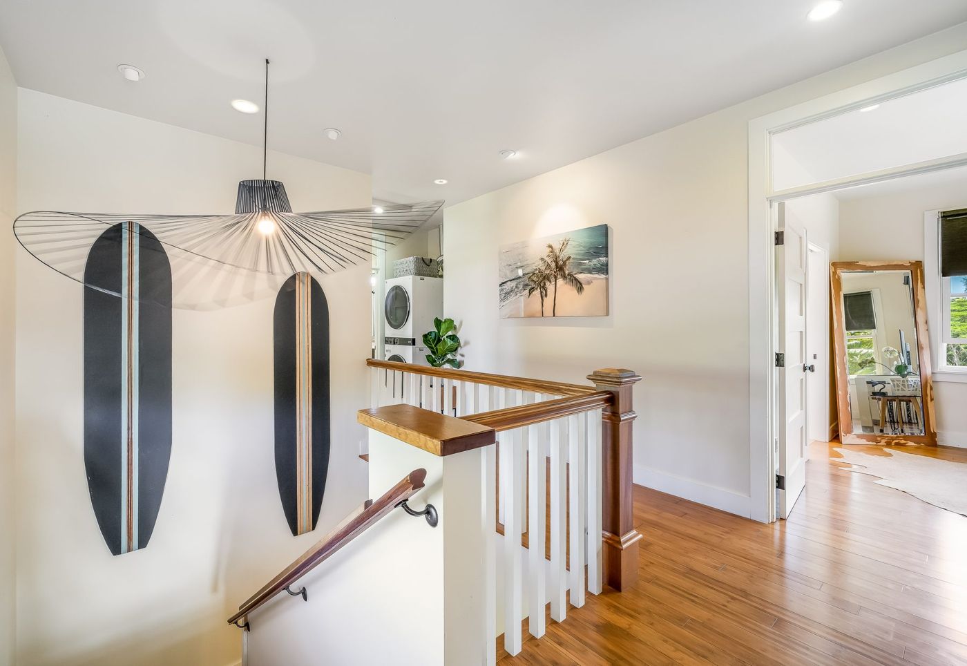 Staircase with surfboards on the wall